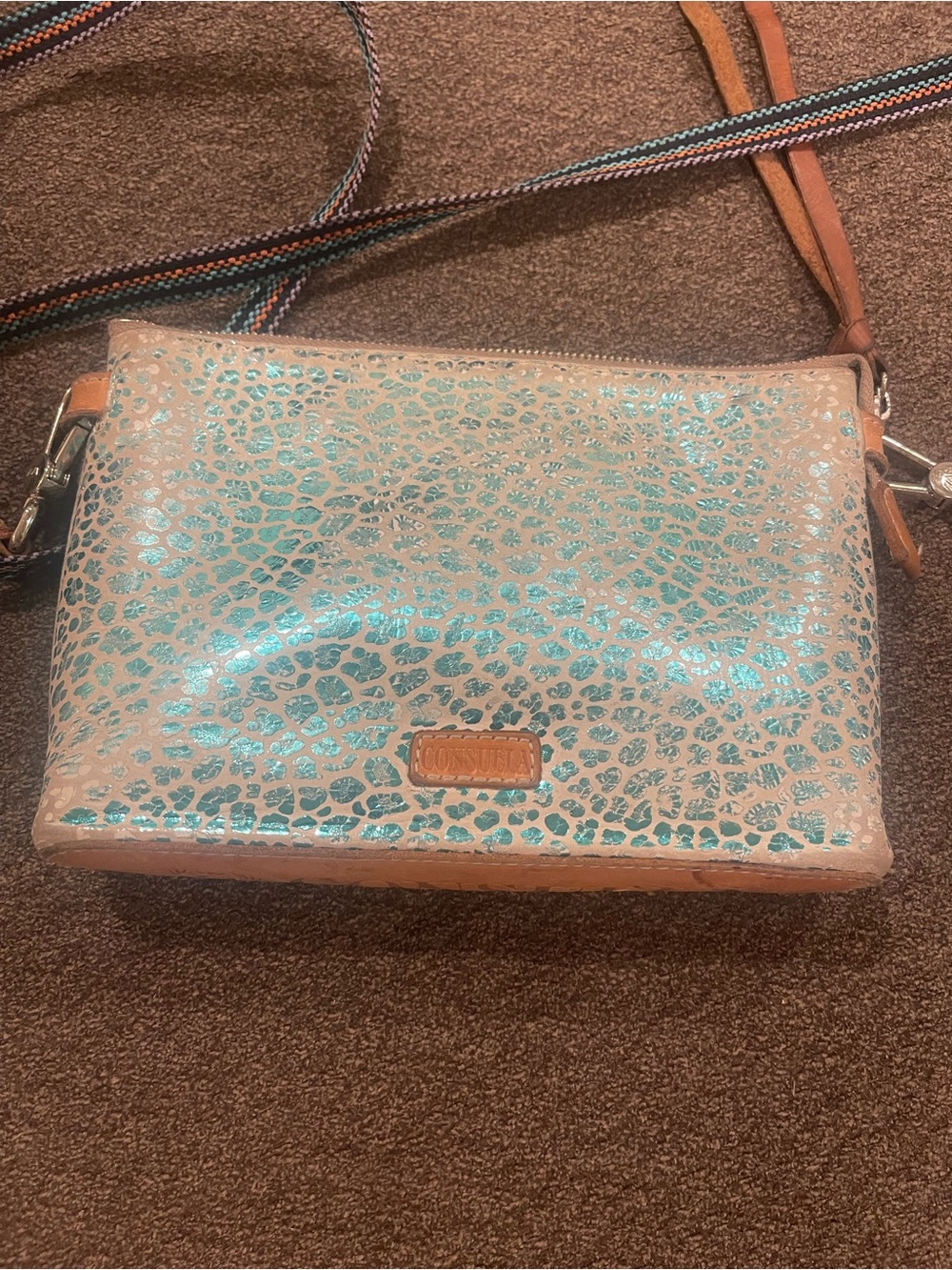 Consuela teal and Beige Crossbody with Turquoise Leopard Accents. Has some wear